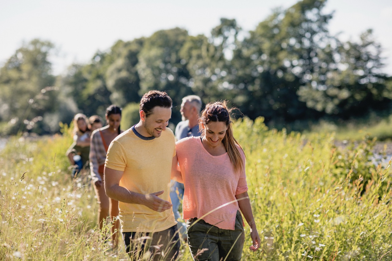 People walking through a field