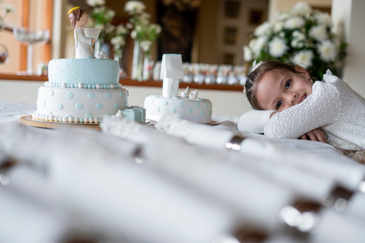 http://Girls%20with%20her%20head%20down%20next%20to%20a%20cake